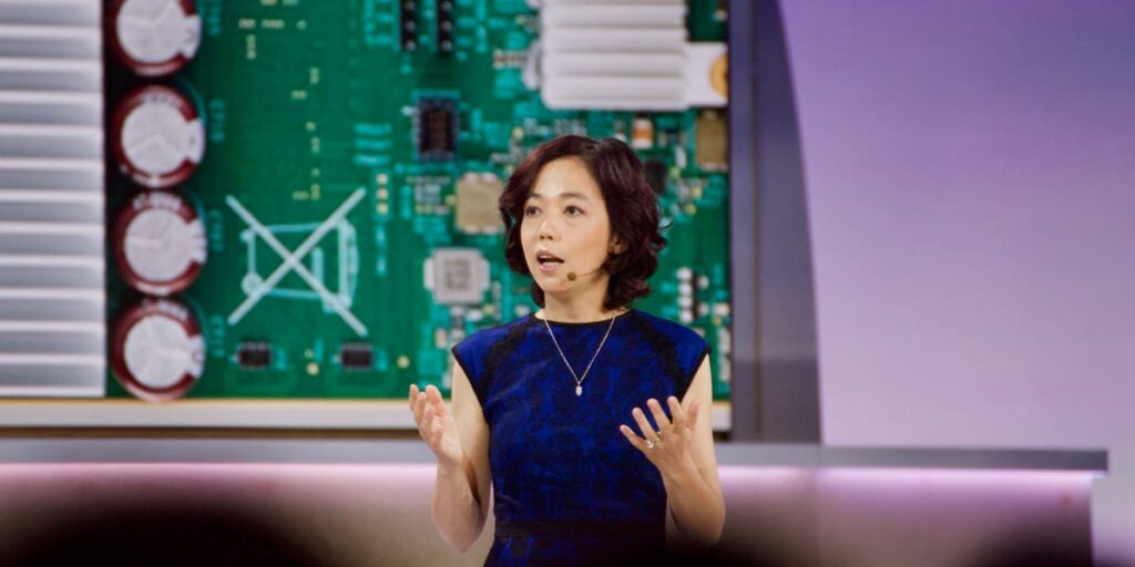 Dr. Fei-Fei Li, AI researcher and professor, speaking at a conference event.