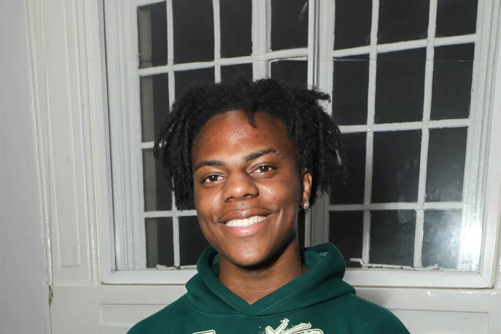 An energetic portrait of streamer IShowSpeed, Darren Watkins Jr smiling warmly.