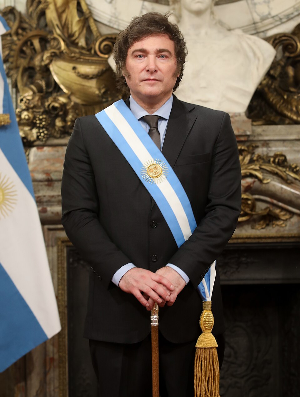 Javier Milei, President of Argentina, looking directly at the camera in a formal suit.