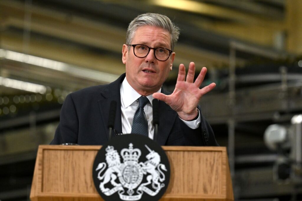 British Prime Minister Keir Starmer speaking at a podium amidst a growing Labour Party leadership crisis.