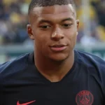 Close-up portrait of French soccer player Kylian Mbappé.
