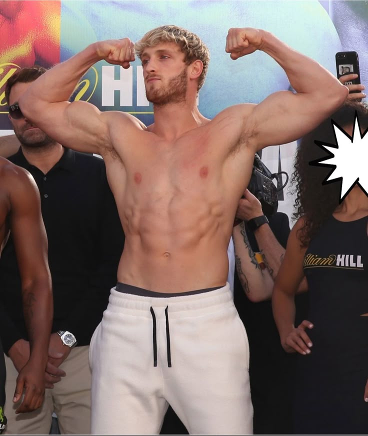 A professional portrait of media personality and wrestler Logan Paul, showcasing his athletic build and blonde hair, looking determined.