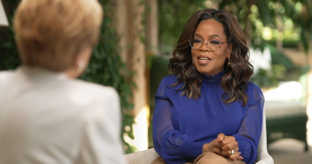 Oprah Winfrey wearing sunglasses and speaking during an interview.