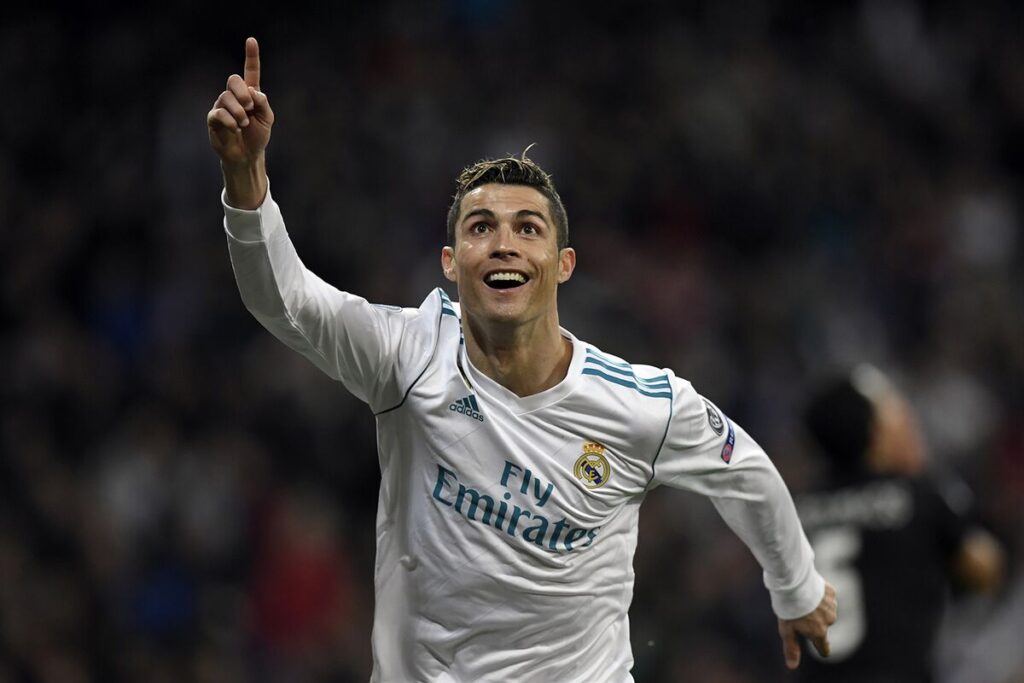 Cristiano Ronaldo celebrating a goal on the soccer field.