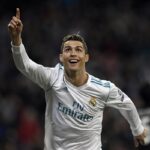 Cristiano Ronaldo celebrating a goal on the soccer field.