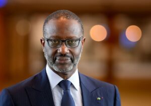 Executive headshot of Ivorian-French businessman and politician Tidjane Thiam.