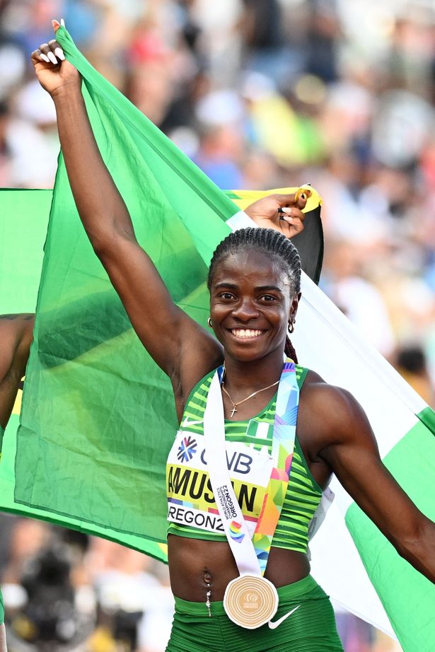 Nigerian track and field athlete Tobi Amusan celebrating on the track.